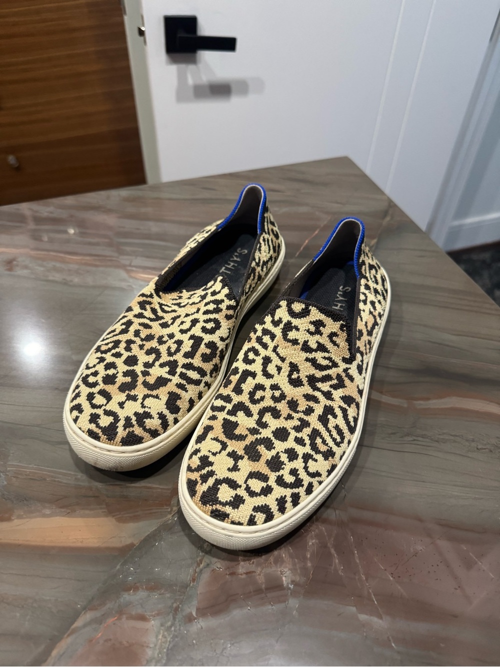 Rothy's Leopard Print Slip-On Sneakers in Tan and Black